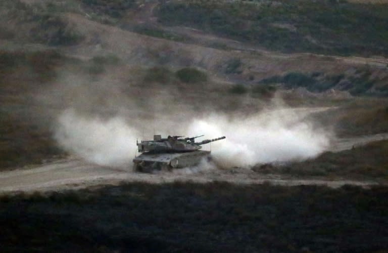 An Israeli army tank patrols along the border between Israel and the Gaza Strip on May 29, 2018