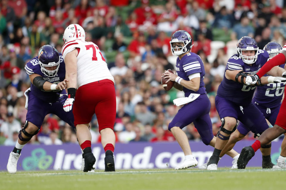 Northwestern quarterback Ryan Hilinski (3) looks to pass during the first half of an NCAA college football game against Nebraska, Saturday, Aug. 27, 2022, at Aviva Stadium in Dublin, Ireland. (AP Photo/Peter Morrison)