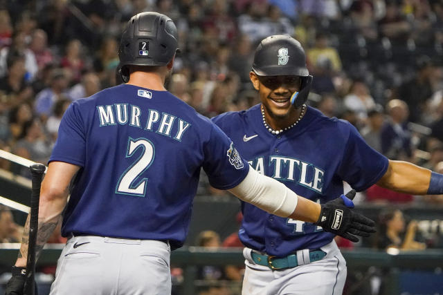 Julio Rodríguez scores the game-winning run after being walked as