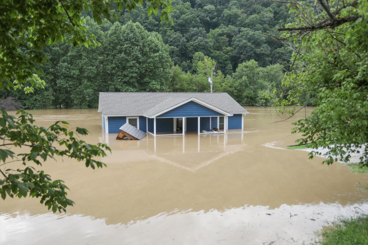 A home is submerged under floodwaters in Jackson, Ky., on Thursday. 