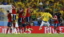 Brazil's David Luiz (4) shoots to score his freekick against Colombia during their 2014 World Cup quarter-finals at the Castelao arena in Fortaleza July 4, 2014. REUTERS/Marcelo Del Pozo