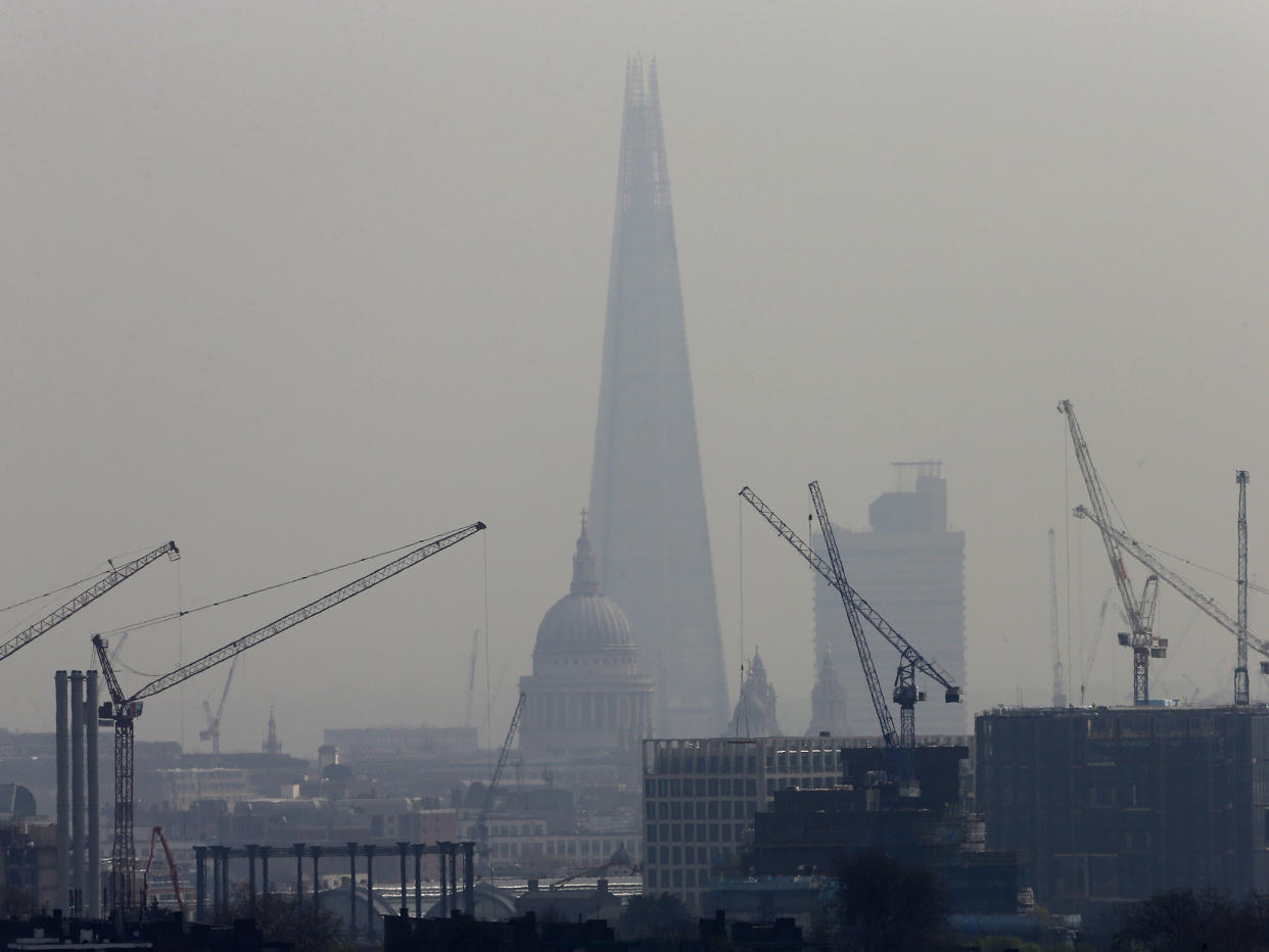 Smog surrounds The Shard, western Europe's tallest building, and St Paul's Cathedral in London: Reuters