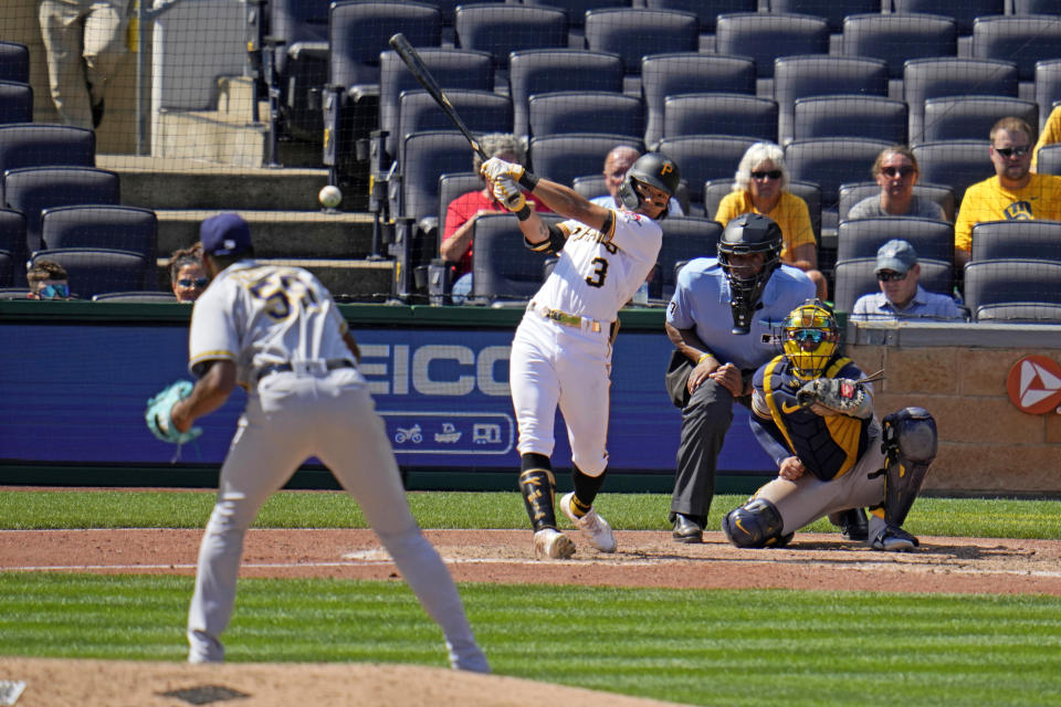 Pittsburgh Pirates' Ji Hwan Bae (3) hits an RBI triple off of Milwaukee Brewers relief pitcher Elvis Peguero (59) during the seventh inning of a baseball game in Pittsburgh, Wednesday, Sept. 6, 2023. (AP Photo/Gene J. Puskar)