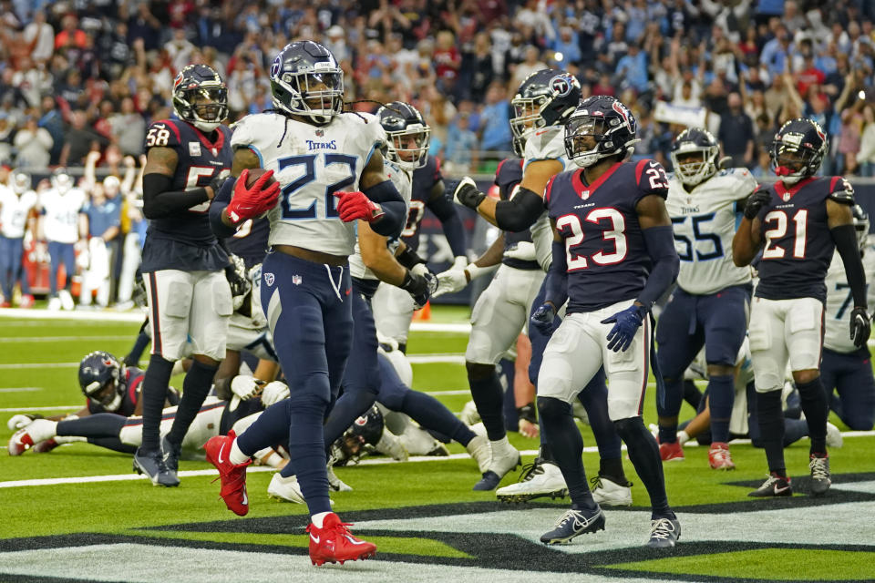 Tennessee Titans running back Derrick Henry (22) scores his second touchdown of the game against the Houston Texans during the second half of an NFL football game Sunday, Oct. 30, 2022, in Houston. (AP Photo/Eric Christian Smith)