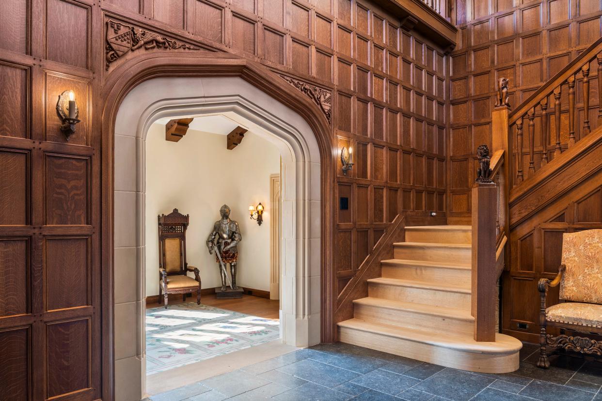 The entry foyer at 3730 Richmond St. is infused with Old World ambience, from the intricately detailed custom millwork to the Gothic archways found throughout the home.