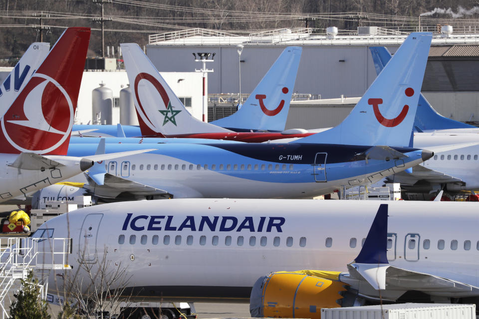 Grounded Boeing 737 MAX airplanes fill a parking area adjacent to Boeing Field, Wednesday, Feb. 19, 2020, in Seattle. Washington state lawmakers say they will introduce bills, at The Boeing Co.'s request, to suspend the aerospace giant's preferential business and occupation tax rate until the United States and European Union resolve their long-running international trade dispute. (AP Photo/Elaine Thompson)