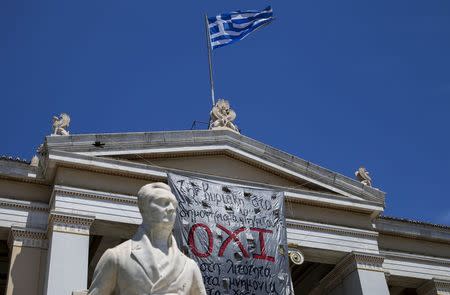 The word 'No' in Greek is seen on a banner hanging from Athens' University building in Athens, Greece, July 2, 2015. REUTERS/Marko Djurica