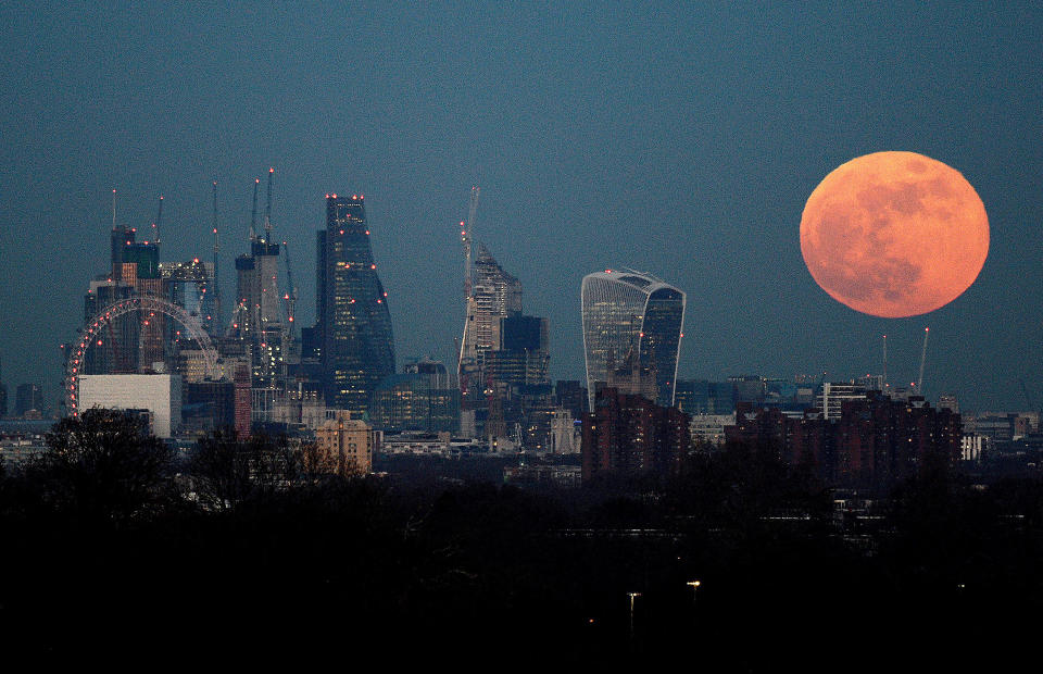 A blue moon rises over the London skyline in January 2018 [Photo: PA]