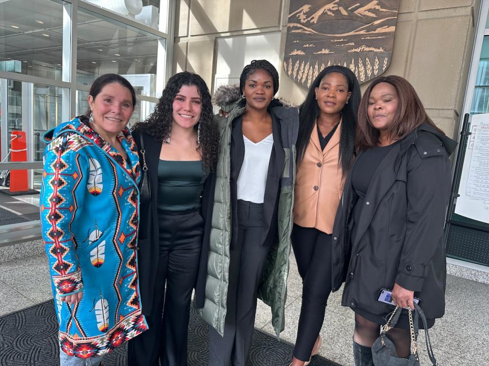 Pictured from left to right: Eileen Gullion and her daughter Michaela Allen-Gullion, who was John Mitchell Smith Jr.'s girlfriend. Smith's sisters, Krystal Smith,  Sade Smith and their mother Cylon Bates. 