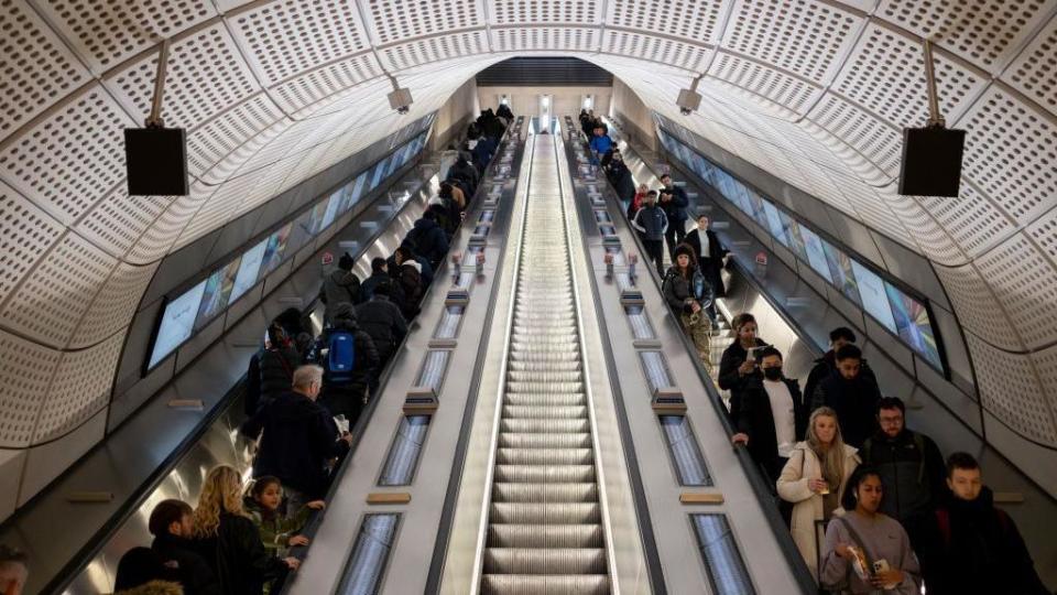 Commuters on escalators