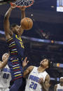 Cleveland Cavaliers' Tristan Thompson (13) dunks against Orlando Magic's Markelle Fultz (20) in the first half of an NBA basketball game, Friday, Dec. 6, 2019, in Cleveland. (AP Photo/Tony Dejak)