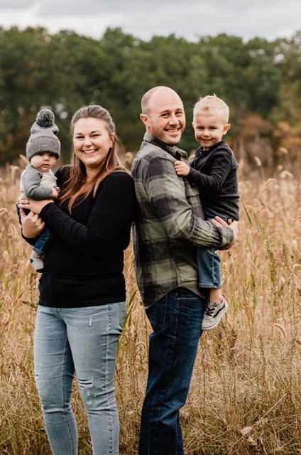 Marcus, his wife Ashley, their sons Aiden and Declan.