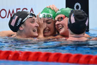 <p>South Africa's Tatjana Schoenmaker (2nd L) reacts with South Africa's Kaylene Corbett (2nd R), USA's Annie Lazor (L) and USA's Lilly King after winning the final of the women's 200m breaststroke swimming event to set a new World Record during the Tokyo 2020 Olympic Games at the Tokyo Aquatics Centre in Tokyo on July 30, 2021. (Photo by Jonathan NACKSTRAND / AFP)</p> 