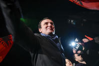 Albin Kurti, leader of the Self-Determination movement (Vetevendosje), arrives to address a celebrating crowd in the Kosovo capital of Pristina, early Monday, Oct. 7, 2019. Two Kosovo opposition parties emerged as the top-vote getters in Sunday's snap election of a new parliament held amid calls for leaders to resume dialogue with Serbia over normalizing ties. Self-Determination supporters took to the streets to celebrate. (AP Photo/Visar Kryeziu)