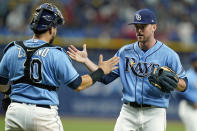 Tampa Bay Rays relief pitcher Jeffrey Springs, right, celebrates with catcher Mike Zunino (10) after the Rays defeated the Boston Red Sox during a baseball game Friday, July 30, 2021, in St. Petersburg, Fla. (AP Photo/Chris O'Meara)