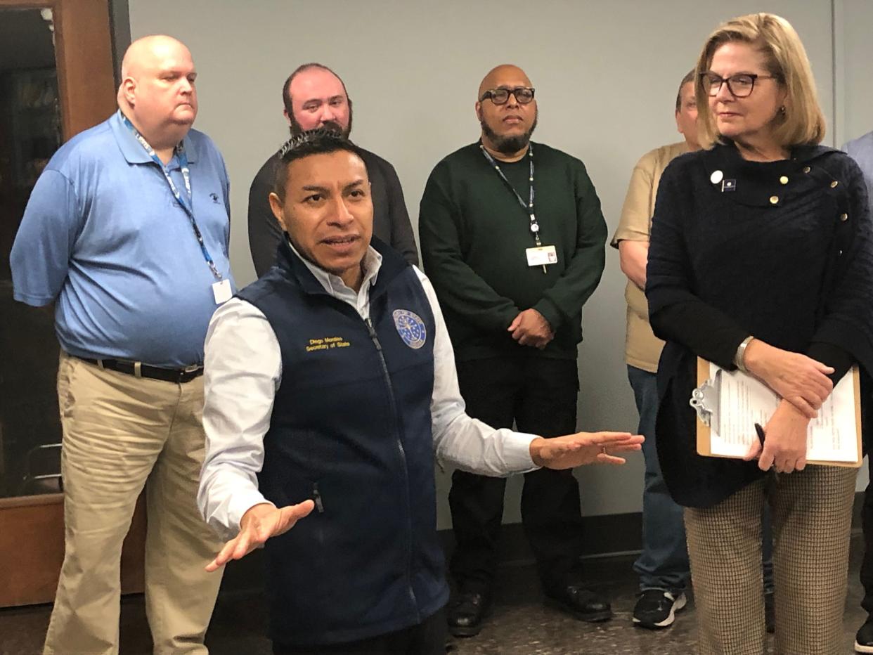 Indiana Secretary of State Diego Morales speaks Friday, Jan. 19, 2024, as he announces a grant to assist St. Joseph County elections alongside county Clerk Amy Rolfes, right, and county election officials at the County-City Building in South Bend.
