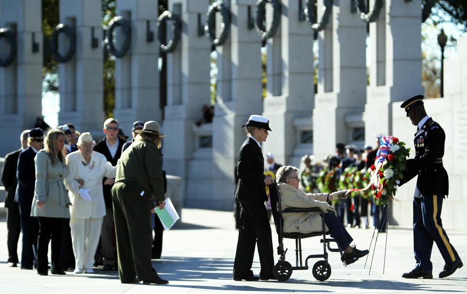 Female Veterans Lay Wreath At World War II Memorial In Washington