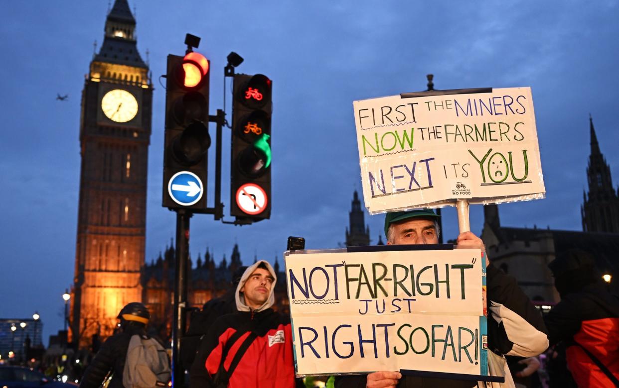 One protester holds a sign reading 'first the miners, now the farmers, next its you'