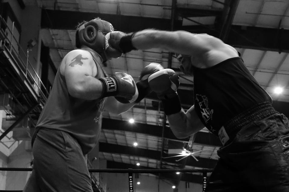 <p>New York State trooper Mike Glassey lands a left on Det. Hugh McHugh during the “Bronx Tough Turkey Tussle” at the New York Expo Center in the Bronx, New York, on Nov. 16, 2017. (Photo: Gordon Donovan/Yahoo News) </p>