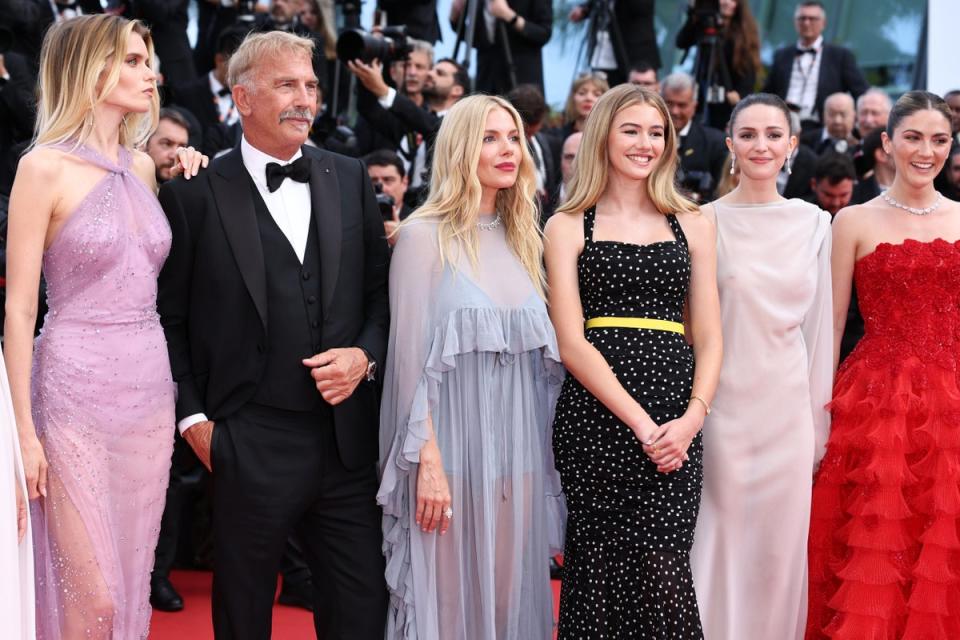 Miller pictured with co-stars (L-R) Abbey Lee, Kevin Costner, Georgia MacPhail, Ella Hunt and Isabelle Fuhrman (Getty Images)