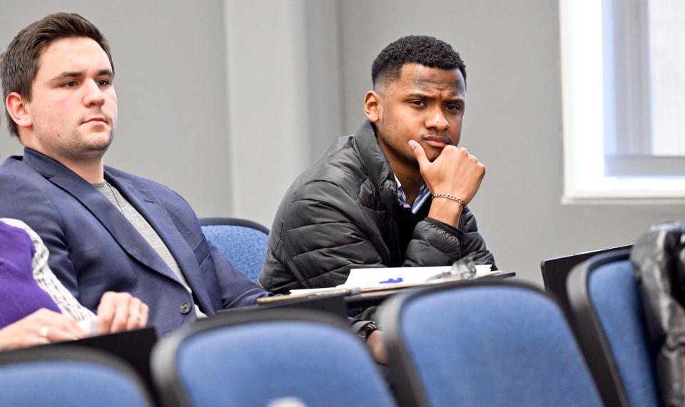 Thalles DeSouza, 24, (right) and Sam Miele,17, of Sandwich listen to Cape Cod lawmakers during a meeting at Cape Cod Community College in March.