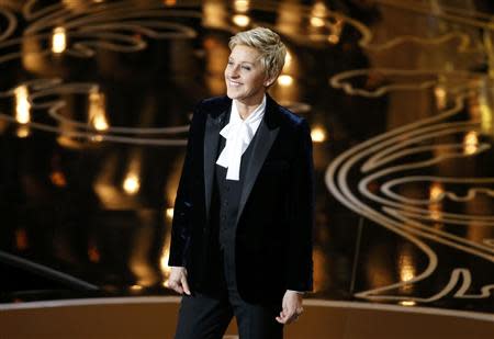 Ellen Degeneres takes the stage to host the show at the start of the 86th Academy Awards in Hollywood, California March 2, 2014. REUTERS/Lucy Nicholson