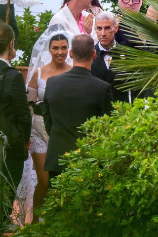 <p>Shutterstock</p> Kourtney Kardashian and Travis Barker's wedding