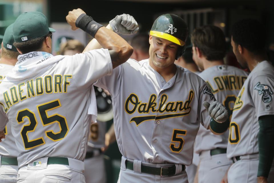 The Oakland Athletics' Jake Smolinski (5) celebrates one of his 16 career major league home runs, the most ever by a Rockford native.