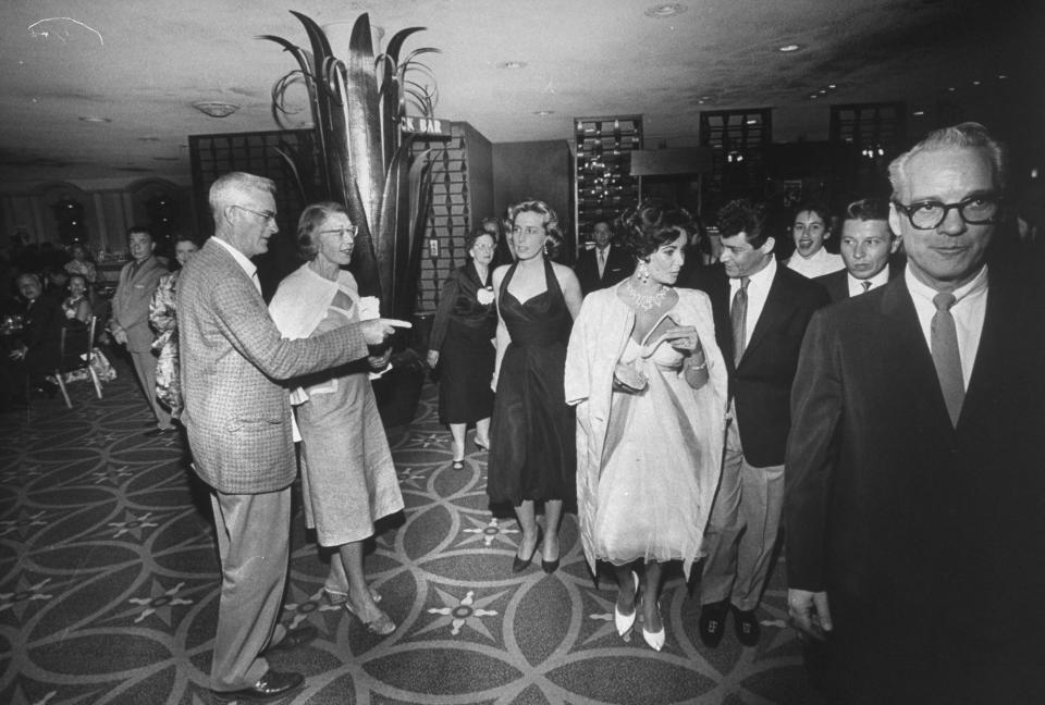 group of celebrities including Elizabeth Taylor and Eddie Fisher in the Tropicana