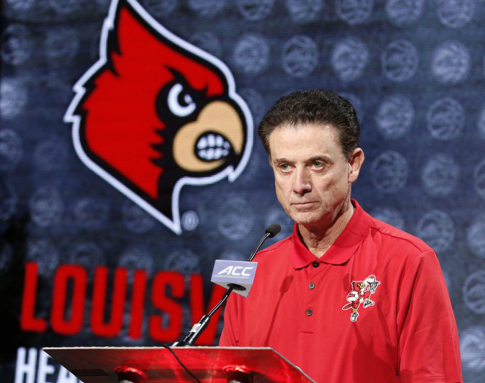 FILE - Louisville NCAA college basketball head coach Rick Pitino answers a question during the Atlantic Coast Conference men's media day in Charlotte, N.C., Oct. 26, 2016. An independent panel has fined Louisville $5,000 and placed the men’s basketball program on two years' probation, but sparing the school major penalties from NCAA allegations leveled in the aftermath of a federal investigation of corruption in college basketball. The Independent Accountability Resolution Process (IARP) also declined to penalize former Cardinals coach Rick Pitino, whom the NCAA initially cited for failure to promote an atmosphere of compliance. (AP Photo/Bob Leverone, File)