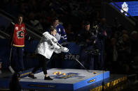 Canada's Marie-Philip Poulin shoots during the Skills Competition shooting stars event, part of the NHL All-Star weekend, Friday, Jan. 24, 2020, in St. Louis. (AP Photo/Jeff Roberson)