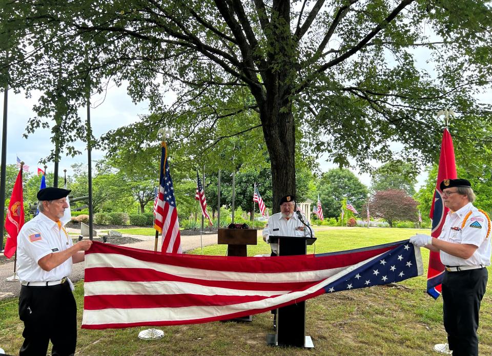 Vietnam Veterans Honor Guard presents 13 Folds of the Flag while explaining the significance of each fold during the Flag Day ceremony at Liberty Garden Arboretum and Park in Jackson, Tenn. on June 14, 2023.