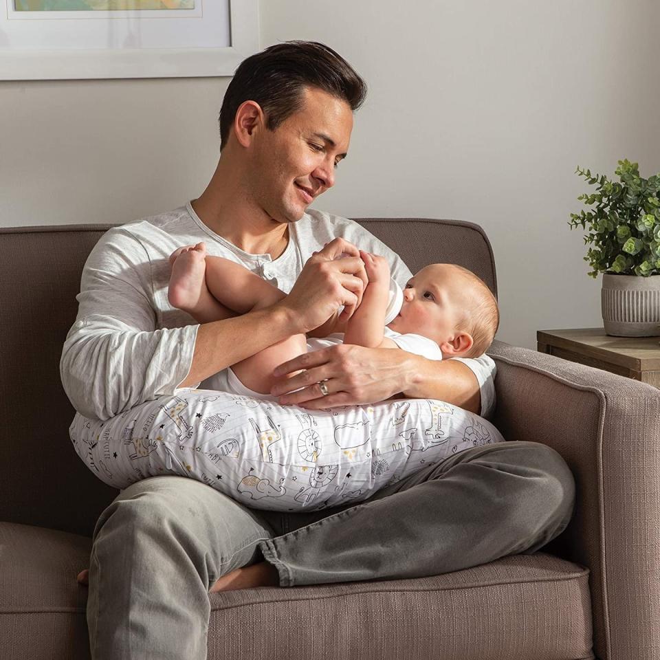 This multipurpose pillow helps with feeding, but it's also great for propping babies up, moving them into tummy time and helping them sit upright. That's one hard-working pillow.<br /><br /><strong>Promising review:</strong> "I wasn't sure when I purchased this as a first-time mom if I'd get a lot of use out of it. I would easily say it's an essential baby product now. It helped so much in the beginning with breastfeeding and cuddling with my newborn. I did find in the very initial newborn stages it was almost too fluffy but I quickly learned how to use it properly as she grew and never went back. <strong>Dad loved it too for cuddling with baby. It helped so much with tired arms and sore backs, fit nicely while sitting in a glider to rock baby to sleep.</strong> We even used it for propping her up for cuter pictures!" &mdash; <a href="https://amzn.to/2Q5DJoA" target="_blank" rel="nofollow noopener noreferrer" data-skimlinks-tracking="5669346" data-vars-affiliate="Amazon" data-vars-href="https://www.amazon.com/gp/customer-reviews/R2IQRLWQ5LE2NG?tag=bfjohn-20&amp;ascsubtag=5669346%2C10%2C22%2Cmobile_web%2C0%2C0%2C0" data-vars-keywords="cleaning,fast fashion" data-vars-link-id="0" data-vars-price="" data-vars-retailers="Amazon">Jessica</a>﻿<br /><br /><strong>Get it from Amazon for <a href="https://amzn.to/3aaPPUc" target="_blank" rel="nofollow noopener noreferrer" data-skimlinks-tracking="5669346" data-vars-affiliate="Amazon" data-vars-asin="B071J1JTHP" data-vars-href="https://www.amazon.com/dp/B071J1JTHP?tag=bfjohn-20&amp;ascsubtag=5669346%2C10%2C22%2Cmobile_web%2C0%2C0%2C7256012" data-vars-keywords="cleaning,fast fashion" data-vars-link-id="7256012" data-vars-price="" data-vars-product-id="16453864" data-vars-product-img="https://m.media-amazon.com/images/I/516yA7IPdJL.jpg" data-vars-product-title="Boppy Original Nursing Pillow and Positioner, Notebook Black and Gold, Cotton Blend Fabric with allover fashion" data-vars-retailers="Amazon">$39.99</a>.</strong>