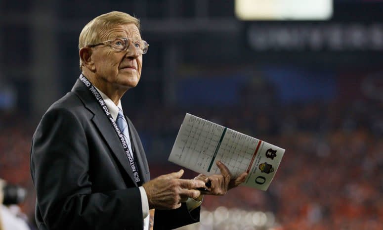 Lou Holtz on the field before a game.