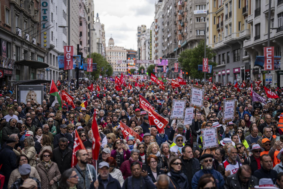 People attend a May Day rally in Madrid, Wednesday, May 1, 2024. (AP Photo/Bernat Armangue)
