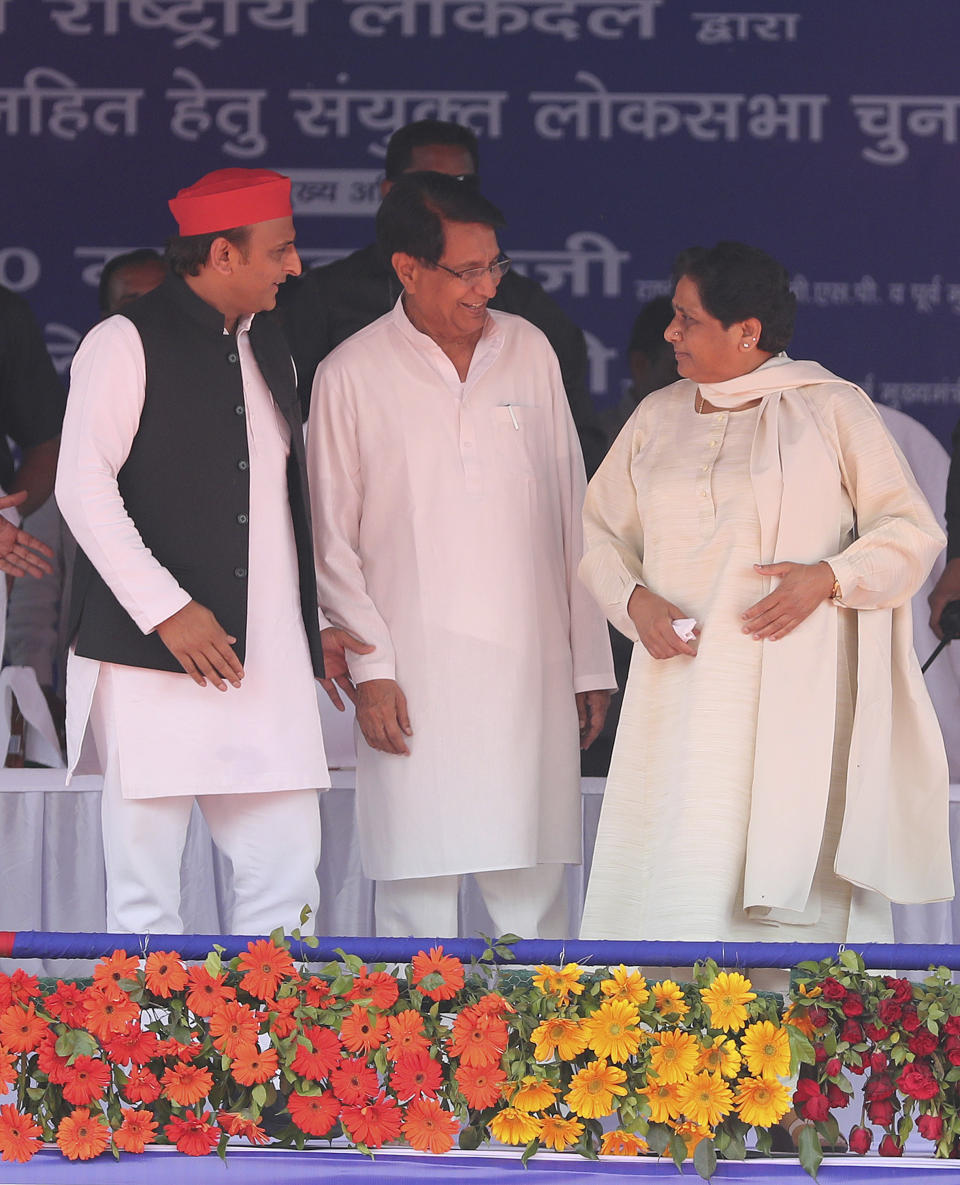 Bahujan Samaj Party (BSP) leader Mayawati, right, Samajwadi Party (SP) leader Akhilesh Yadav, left and Rashtriya Lok Dal (RLD) leader Ajit Singh, center, share the stage during an election rally in Deoband, Uttar Pradesh, India, Sunday, April 7, 2019. Political archrivals in India's most populous state rallied together Sunday, asking voters to support a new alliance created with the express purpose of defeating Prime Minister Narendra Modi's ruling Hindu nationalist Bharatiya Janata Party. (AP Photo/Altaf Qadri)