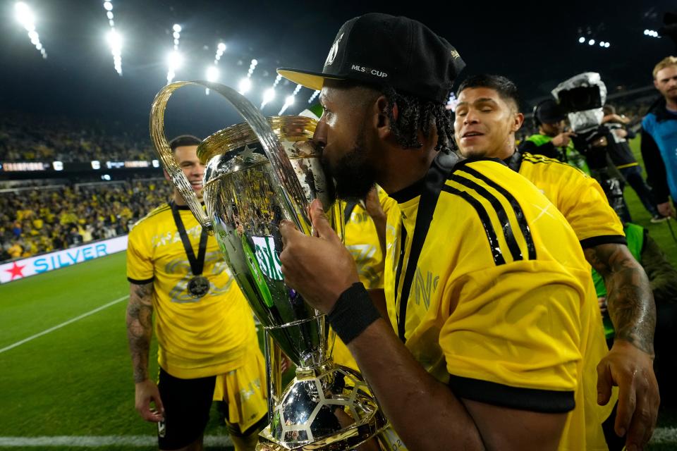 Crew defender Steven Moreira kisses the Philip J. Anschutz Trophy after defeating Los Angeles FC 2-1 in the 2023 MLS Cup championship game.