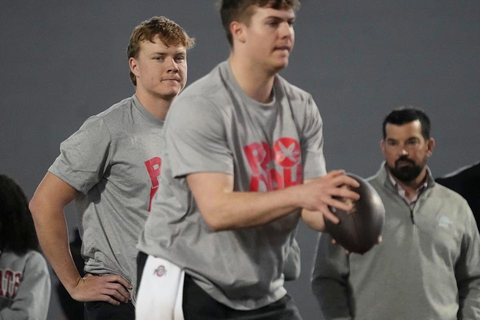 Mar 20, 2024; Columbus, Ohio, USA; Ohio State Buckeyes head coach Ryan Day and quarterback Devin Brown watches as quarterback Will Howard takes a snap during Pro Day at the Woody Hayes Athletic Center.