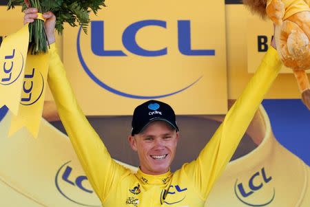 Cycling - Tour de France cycling race - The 184-km (114,5 miles) Stage 8 from Pau to Bagneres-de-Luchon, France - 09/07/2016 - Team Sky rider Chris Froome, new yellow jersey leader, reacts on the podium after winning the stage. REUTERS/Juan Medina