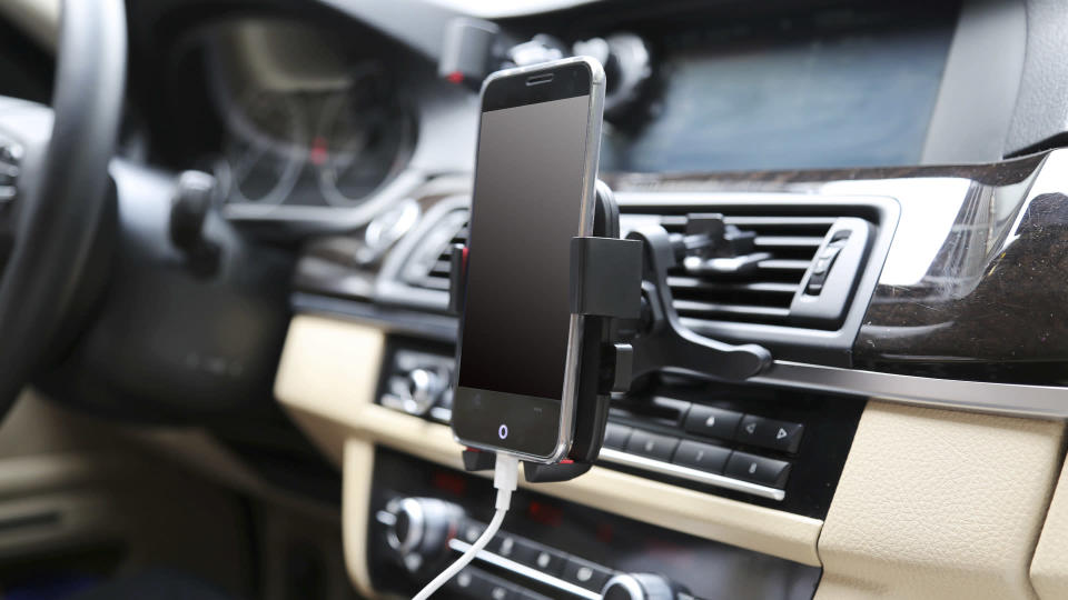 <p>No GPS, Apple Carplay or Android Auto in your cheap car? No problem. A phone mount allows you to easily see your phone and use its map apps to get around. You can find phone mounts that attach to your dashboard or air vent for under $15.</p> <p><small>Image Credits: helena0105 / Shutterstock.com</small></p>