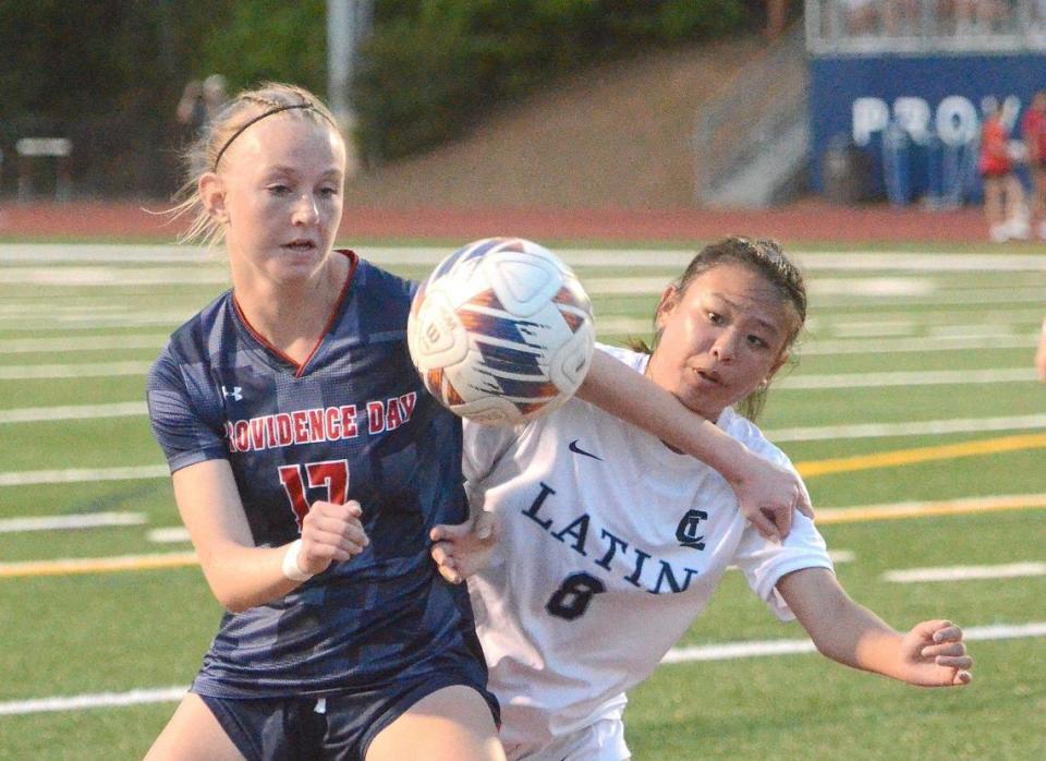 Providence Day midfielder #17 Blane McElroy battles Charlotte Latin’s #8 Sunny Lin the first half. Unbeaten Charlotte Latin visits unbeaten Providence Day for a much anticipated girls soccer match. Both teams are ranked among the nation’s top 10. They faced off on Tuesday, April 2, 2024.