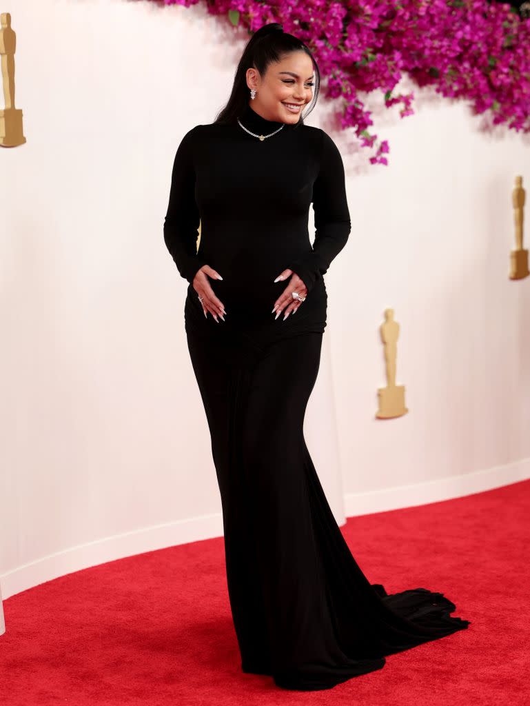 Hudgens, 35, wore a gorgeous black gown showing off her bump while keeping her hair simple in a high ponytail that cascaded down her back. John Salangsang/Shutterstock