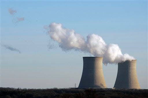 Steam rises from one of the two cooling towers Monday, Jan. 30, 2012, at the Byron nuclear generating station in Ogle County, Ill. A loss of power coming into the plant caused one of the reactors to automatically shutdown Monday morning. U.S. officials said they may have traced a power failure at a nuclear reactor in Illinois to a failed piece of equipment at a switchyard that delivers power to and from the plant.  (AP Photo/Rockford Register Star, Max Gersh) MANDATORY CREDIT