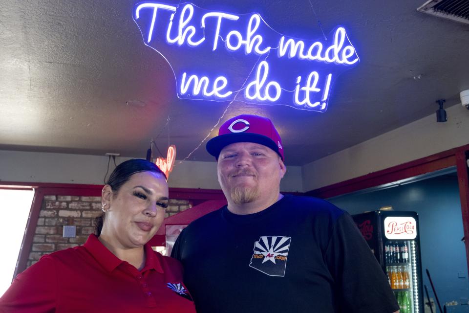 Ilse Jazmin Valenzula Sears (left) and her husband, Samuel, use TikTok to help grow their restaurant business, AZ Taco King in Avondale.