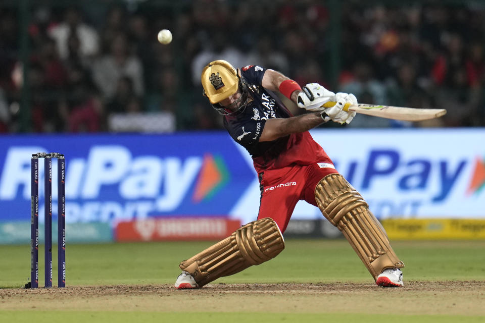 Royal Challengers Bangalore's Glenn Maxwell hits a boundary during the Indian Premier League cricket match between Royal Challengers Bangalore and Lucknow Super Giants in Bengaluru, India, Monday, April 10, 2023. (AP Photo/Aijaz Rahi)