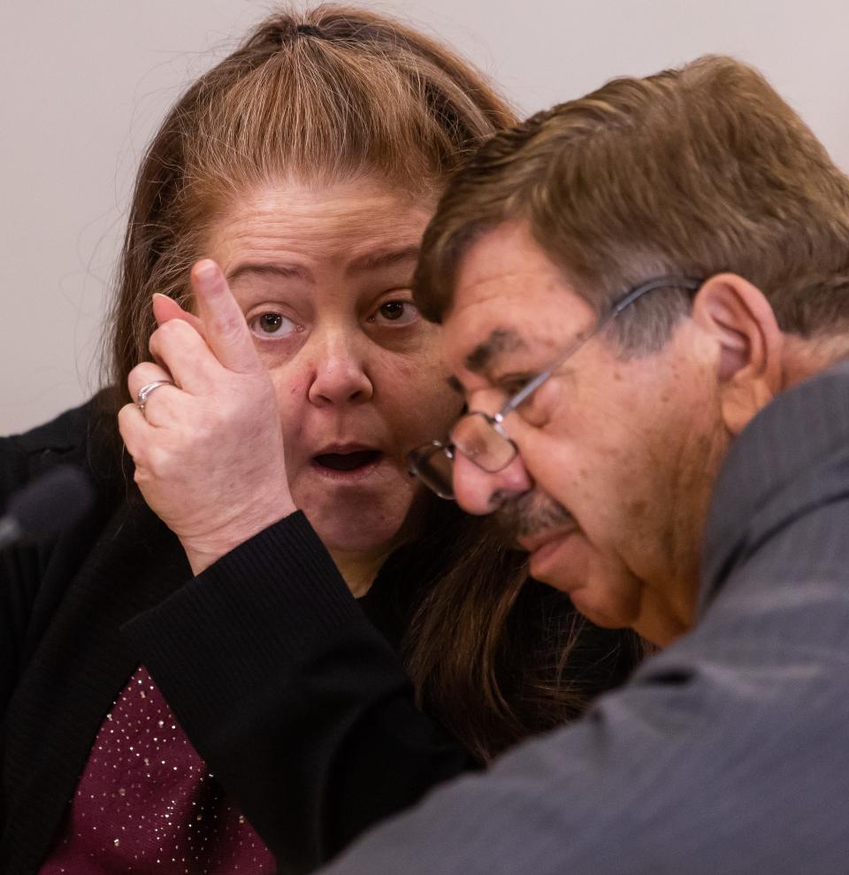 Jennifer S. Hill, left, talks with her attorney, Jack Maro, during her second-degree murder trial on Tuesday at the Marion County Judicial Center in Ocala.