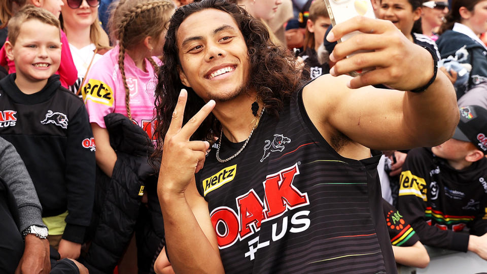 Jarome Luai poses for a photo with Penrith Panthers fans.