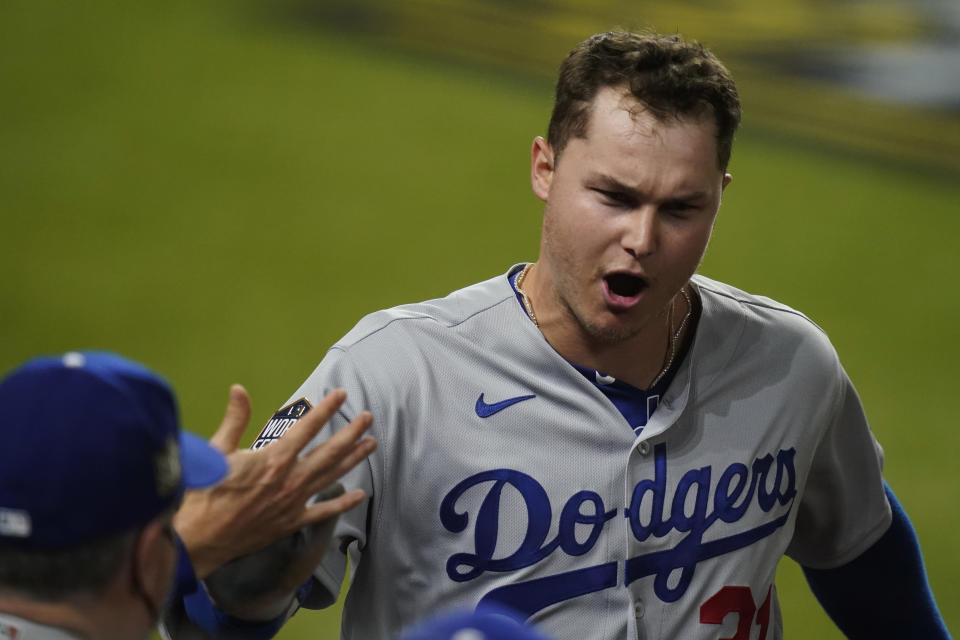 Los Angeles Dodgers' Joc Pederson celebrates a home run against the Tampa Bay Rays during the second inning in Game 5 of the baseball World Series Sunday, Oct. 25, 2020, in Arlington, Texas. (AP Photo/Eric Gay)