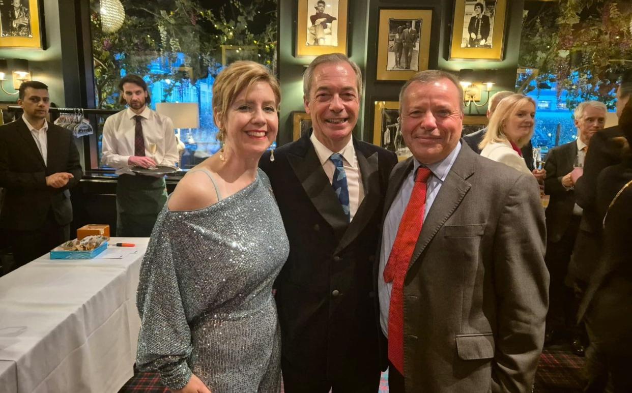 Nigel Farage is pictured celebrating his 60th birthday, with Liz Truss among the attendees