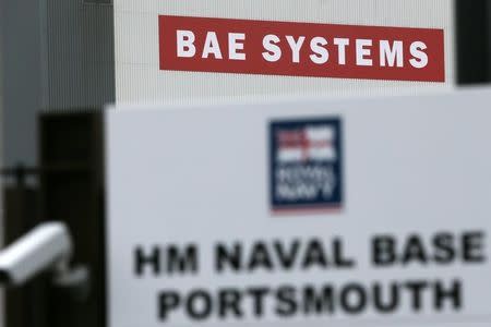 A BAE Systems sign is seen at the naval dockyards in Portsmouth, southern England November 6, 2013. REUTERS/Stefan Wermuth